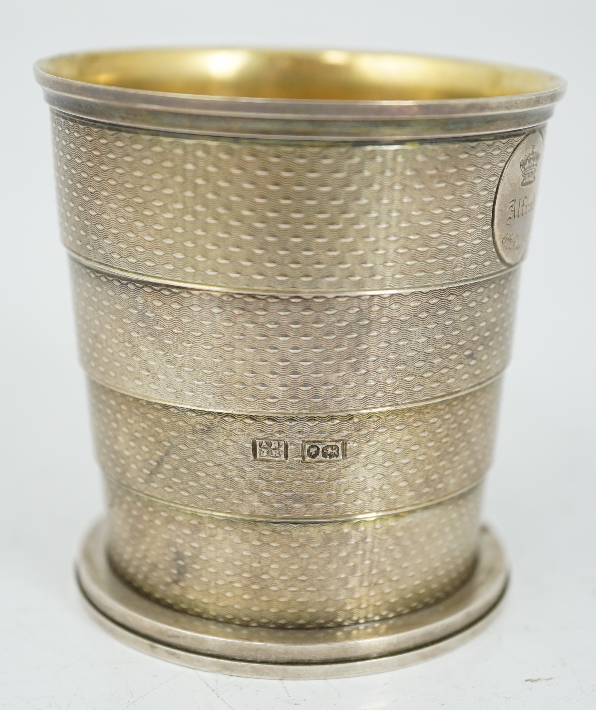 ROYAL INTEREST: A cased Victorian textured silver collapsible travelling cup, by Brownett & Rose, with later engraved inscription, 'Presented By Her Royal & Imperial Highness The Duchess of Saxe Coburg & Gotha Duchess of